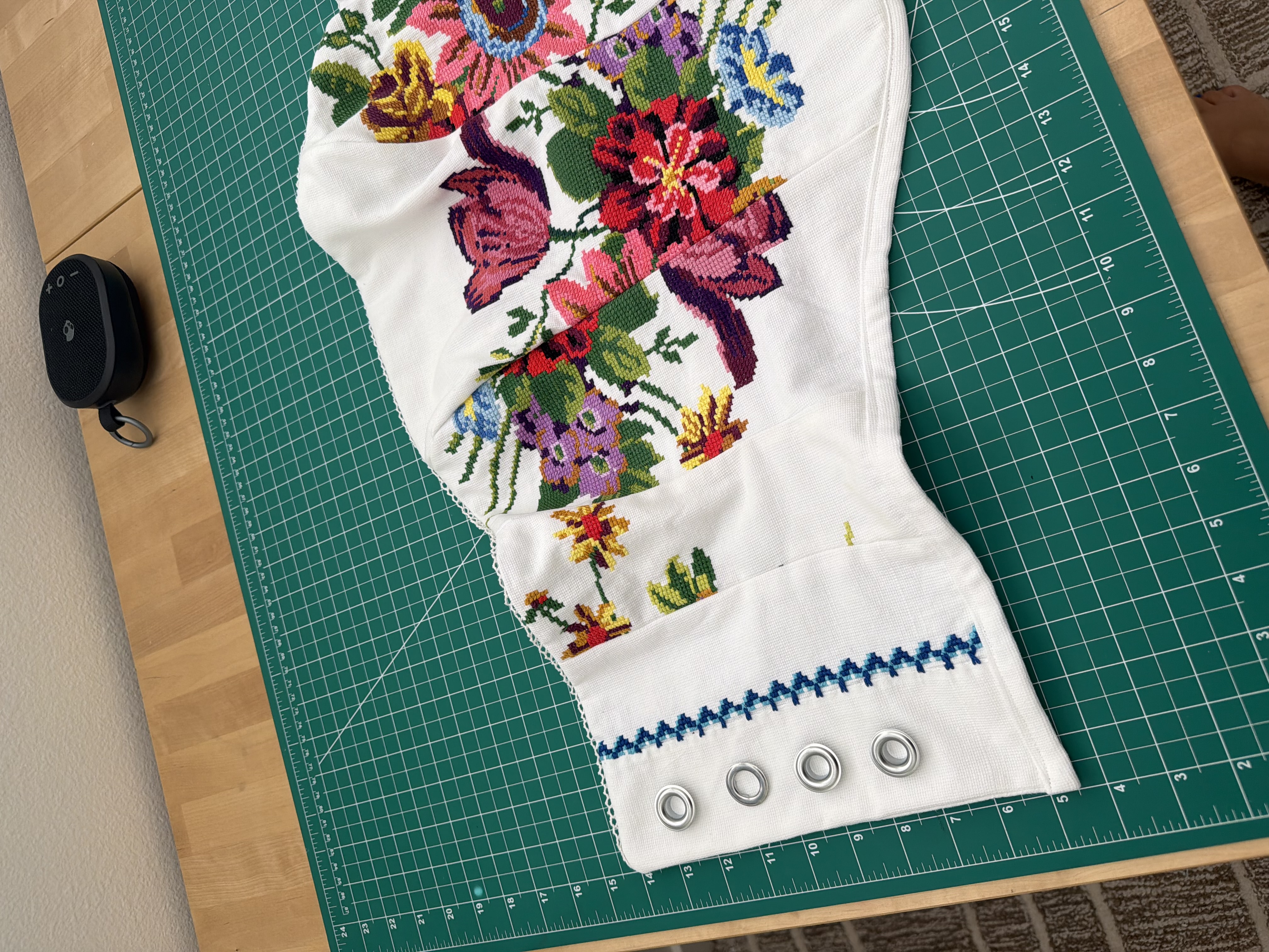 Silver grommets set down first to compare, next to the blue zigzag needlepoint trim